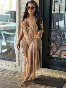 Sexy tan crochet one-piece swimsuit featuring dramatic long fringe tassels for stylish beachwear
