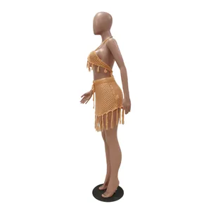 Close-up side view of a two-piece knit mesh bikini beachwear set featuring fringe details