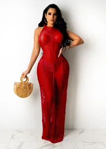 Elegant red knitted sheer maxi beach dress with hollow-out design worn by a female model
