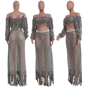 Detailed views of mesh knit beach set featuring tassel off-shoulder top and maxi skirt