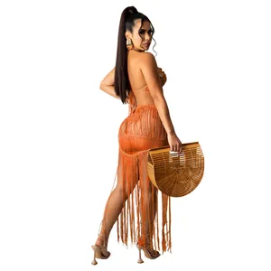 Sexy burnt orange knit two-piece beach set featuring a fringe tassel skirt and halter top