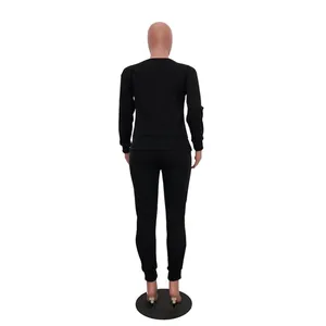 Back view of black casual two-piece sweatshirt and pants set for women