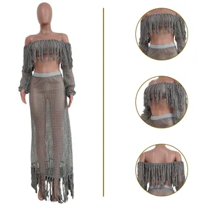 Detailed view of grey mesh fringe beach two-piece set with long sleeves and skirt