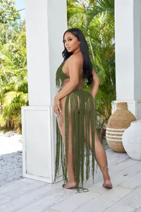 Detailed back view of a stylish olive green crochet monokini with long fringe accents.