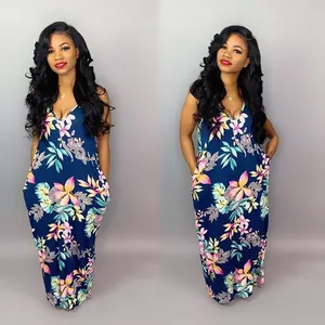 Elegant navy floral print maxi dress featuring a V-neckline and tropical botanical patterns.