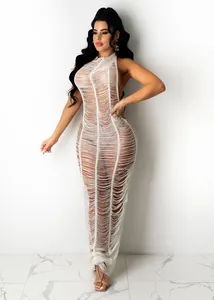 Sultry white distressed knit beach maxi dress featuring unique shredded texture detail