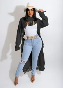 Full-length shot of a stylish women's long black knit cardigan with fringe details