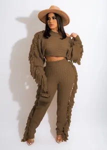 Full body view of a trendy brown knitted set with unique fringe detailing on sleeves and legs.
