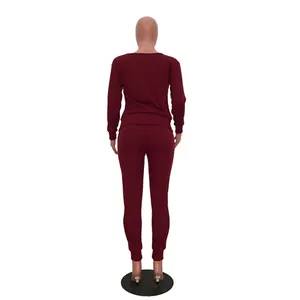 Back view of burgundy long-sleeve top and leggings casual two-piece set for women