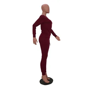 Side view of a burgundy long-sleeve top and matching leggings casual lounge set