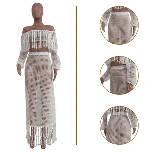 Detailed views showing the white crochet mesh fabric and fringe tassels of the two-piece set