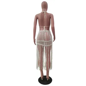 Back view of a white knitted mesh beach two-piece set with long tassel fringe