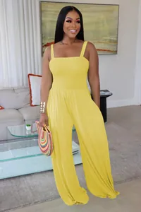 Detail view of stylish yellow smocked tube top jumpsuit with wide-leg pants for women