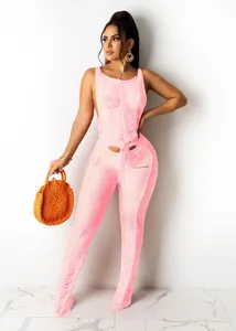 Detailed view of a sexy pink knit hollow-out jumpsuit designed for chic beachwear.