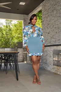 Elegant floral print mini dress featuring mesh patchwork and a stylish ruffle hem