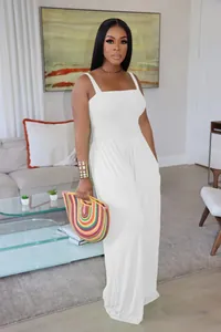 Elegant white smocked wide-leg jumpsuit featuring thin spaghetti straps for summer