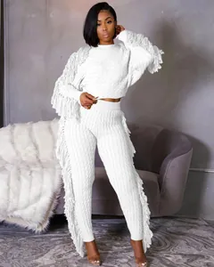 Elegant white knitted two-piece set with stylish fringe detailing on sleeves and legs