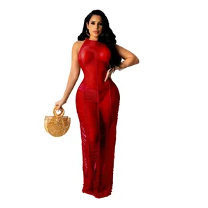 Detail of sexy red hollow-out knit beach maxi dress with halter neckline