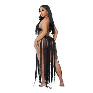 Back view of sexy black crochet knit swimsuit featuring extra long fringe detail