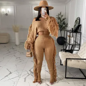 Stylish two-piece knitted set for women with trendy fringe details on sleeves and pants