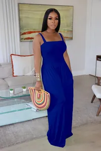 Detailed close-up view of a royal blue smocked bodice wide-leg jumpsuit for women's fashion.