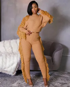 Detailed view of the camel-colored knitted two-piece set featuring stylish fringe tassels
