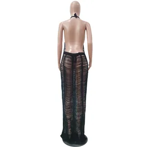 Rear view of sexy black knitted beach maxi dress with backless hollow design