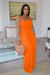 Elegant bright orange smocked bodice wide-leg jumpsuit with stylish spaghetti straps