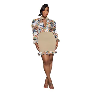 Detailed view of floral print mesh dress with ruffle hem and smocked waist design