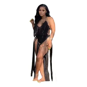 Detailed view of black hollow knit one-piece swimsuit with bohemian long fringe