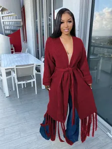 Elegant burgundy long-knit cardigan featuring a waist belt and stylish fringe hem detail.
