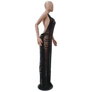 Side view showing the shredded knit texture of a sexy black backless maxi dress.