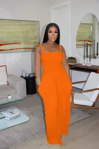 Modern bright orange sleeveless wide-leg jumpsuit with a smocked bodice for women