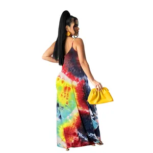Side back view of a vibrant tie-dye maxi dress showcasing colorful patterns and thin straps