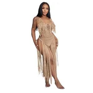 Detail view of hollow knit one-piece swimsuit with long hanging fringe decoration.
