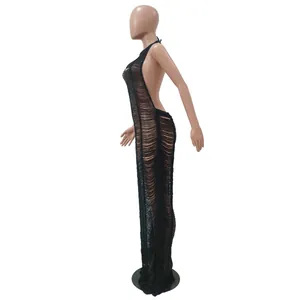 Detailed side profile view of a sexy black distressed knit maxi dress for beachwear