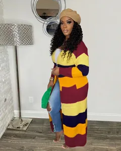 Full length view of a stylish colorful striped knit long cardigan on a female model