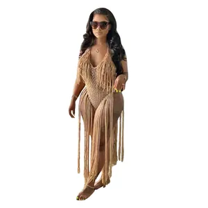 Detailed view of beige hollow out crochet knitted swimsuit with long fringe decoration