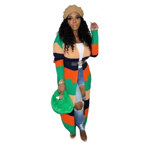 Model wearing casual color-blocked knit long cardigan with vibrant horizontal stripes