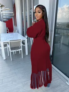 Elegant women's long burgundy knit cardigan sweater with stylish fringe hem detail