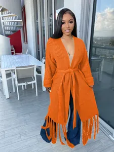 Stylish orange long-sleeved knitted cardigan featuring fringe hem and waist tie detail