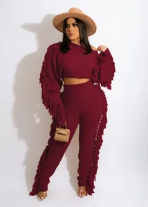 Macro detail showing fringe accents on a burgundy long sleeve knit 2-piece set for women