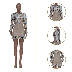Detailed view of a floral patchwork mini dress with mesh skirt and ruffled hem.