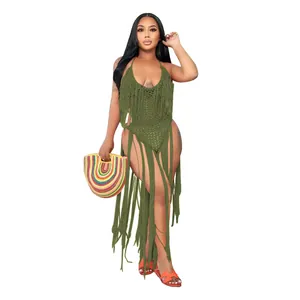 Close-up of green crochet one-piece swimsuit with long decorative fringe details