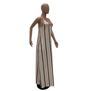 Side view of a striped maxi dress with vertical black and red lines on a mannequin