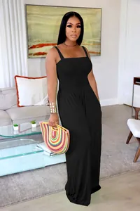 Full-length black wide-leg jumpsuit with smocked bodice and spaghetti straps