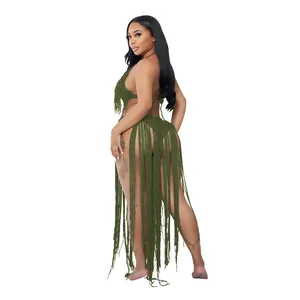 Detailed view of dark green hollow knit swimsuit with extra-long fringe tassels