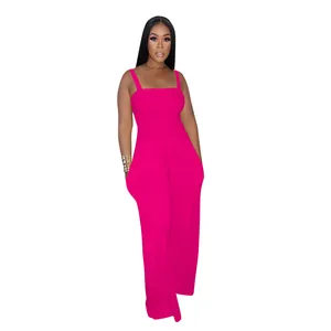 Full length view of a vibrant hot pink smocked bodice wide-leg jumpsuit for women