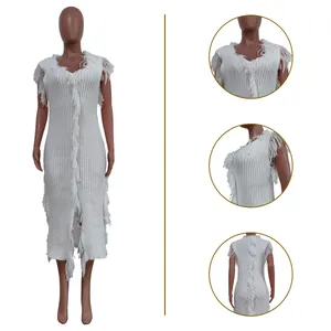 Close-up views of a white sleeveless knitted midi dress with fringe and tassel details