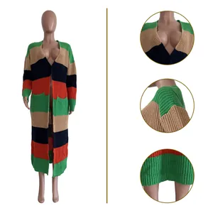 Detail view of colorful striped long knit cardigan with thick hand-knitted texture.